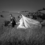 Akaroa wedding photographer with the bride and groom in a paddock at Mt Vernon Lodge