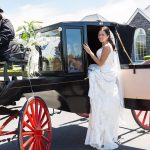 Stoneleigh Lodge photo bride getting into a horse draw carriage