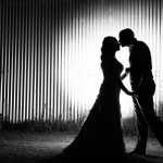 A black and white silhouette Wedding photograph of the bride and groom