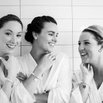 bridesmaids post for glamour shot before getting ready for a wedding