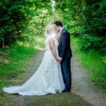 Hanmer Heritage Hotel wedding with a forest photo of the bride and groom backlit with a flash