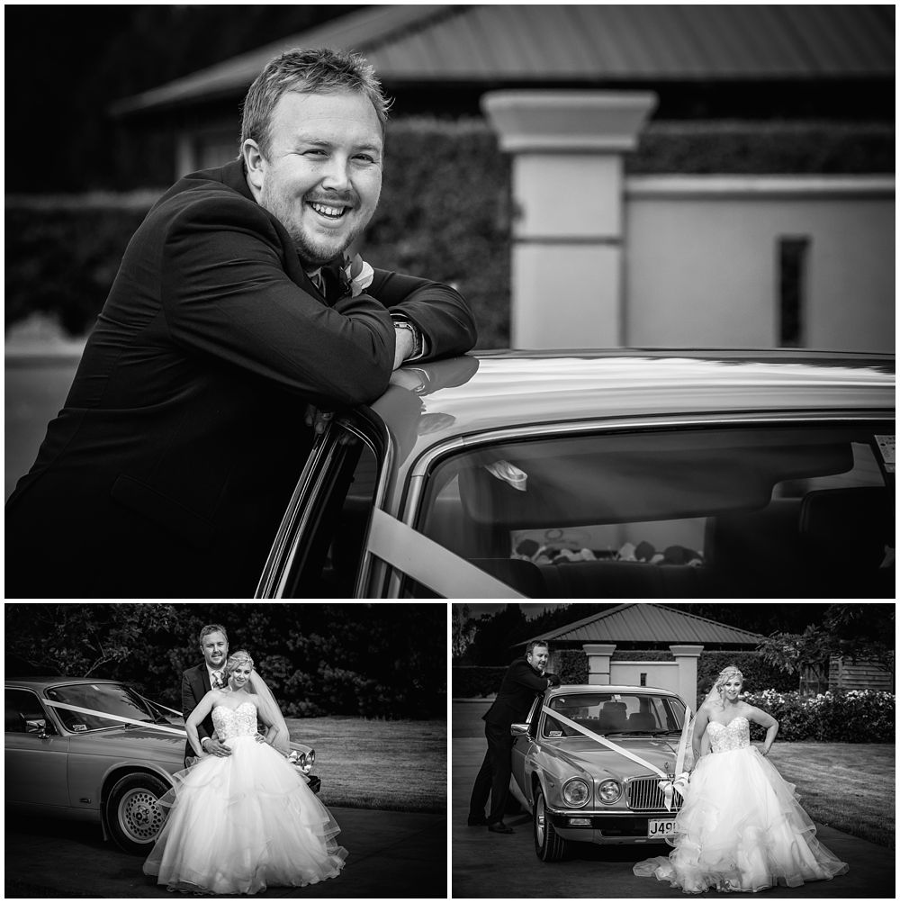 Bride and groom standing by bridal car  