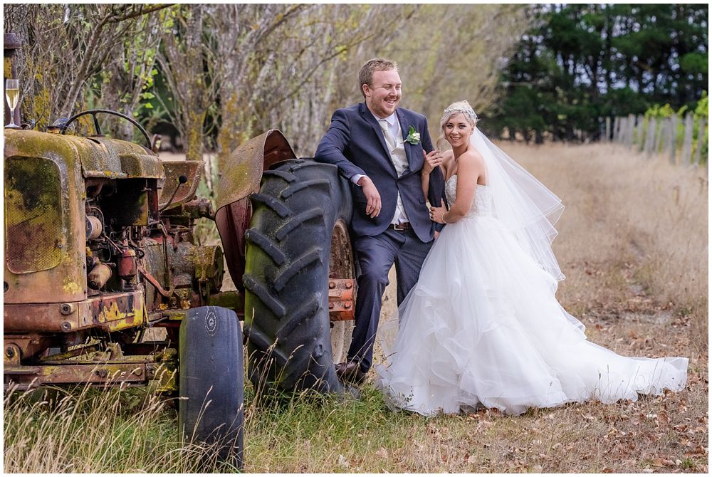 Darjon Vineyard Wedding Venue couple by vintage tractor 