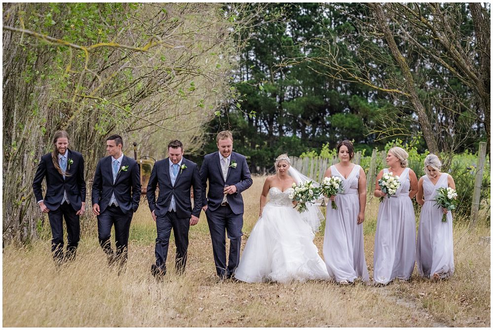 Bridal party walk in line at Darjon Vineyard Wedding Venue