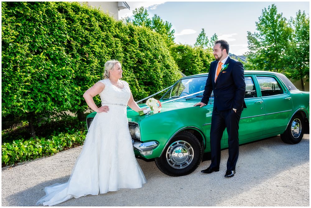 Heritage Hanmer Springs Wedding-bride and groom standing by the bridal car 