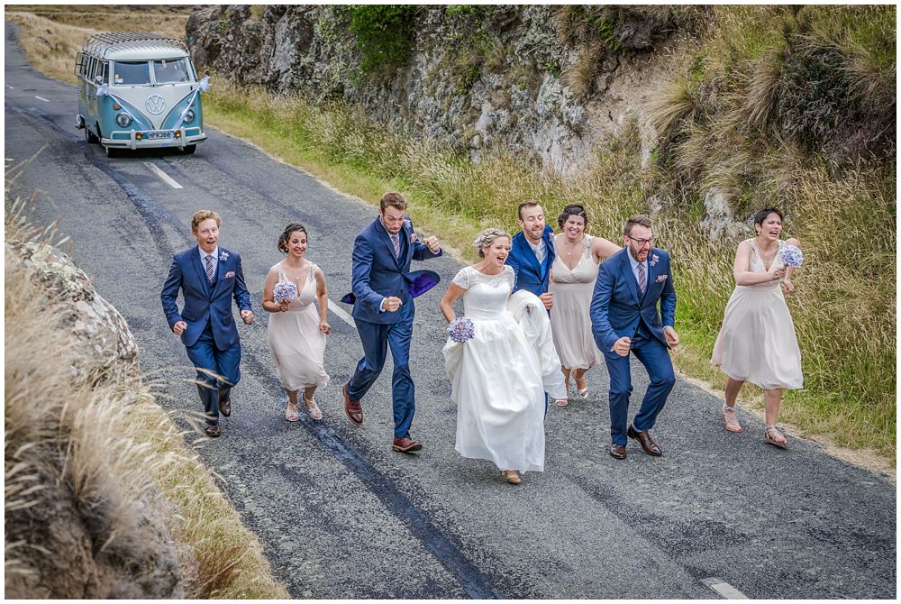 Tannery Wedding-bridal party running away from a blue and white combi van