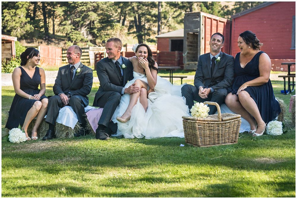 Tipapa Woolshed Barn Wedding Venue bridal party sitting on hay bails