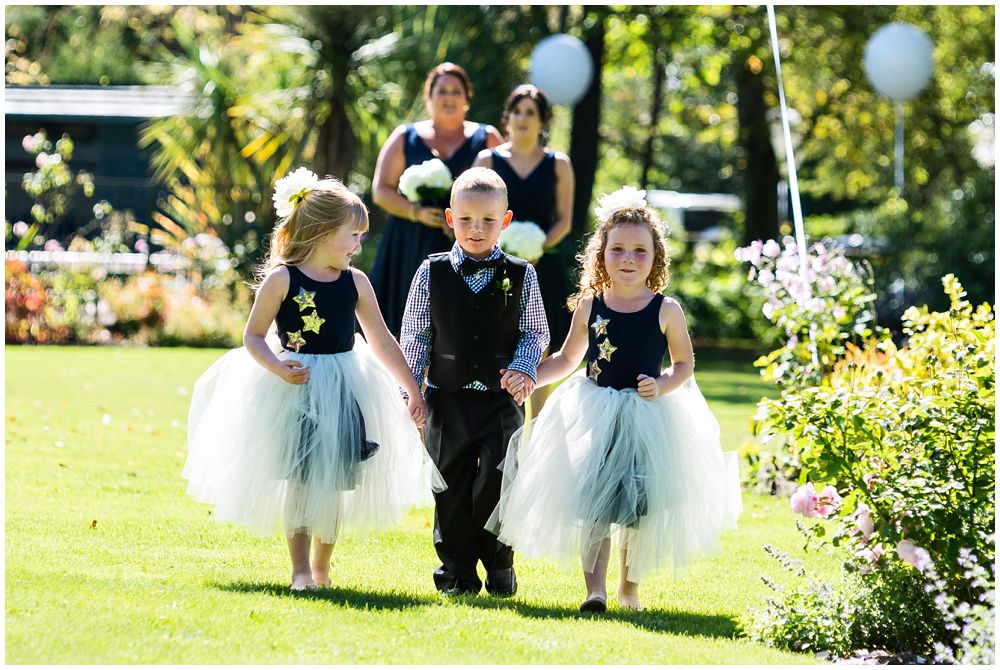 Flower girls-pageboy walking the aisle at Tipapa Woolshed Barn Wedding Venue