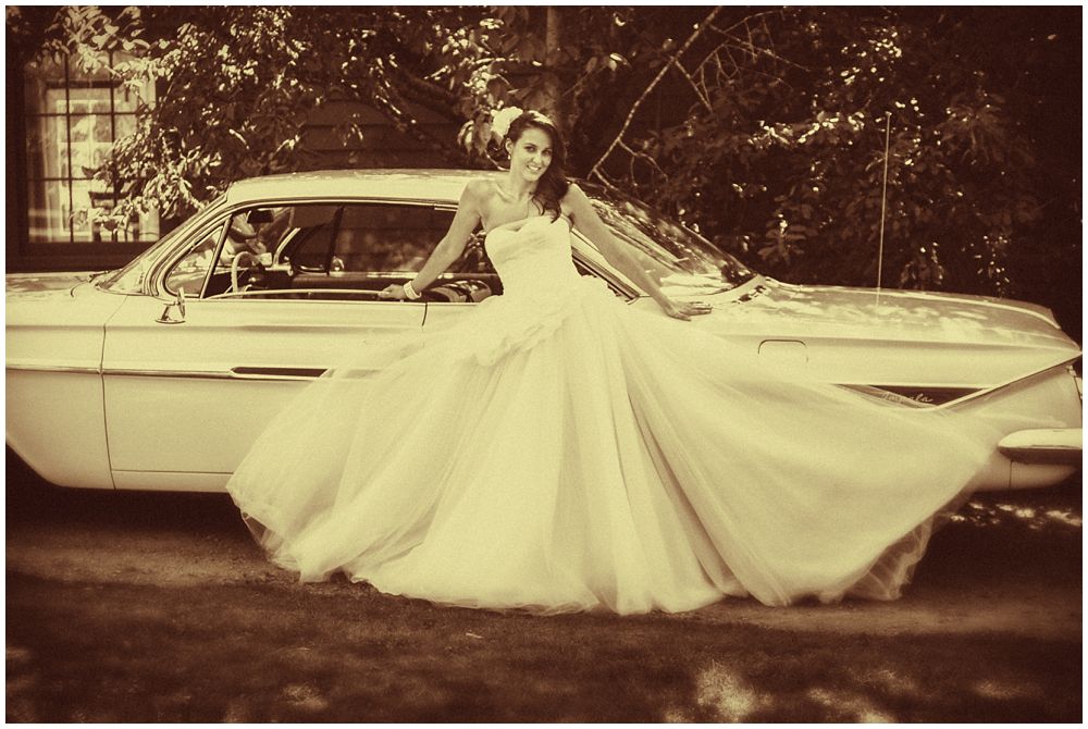 Tipapa Woolshed Barn Wedding bride leaning on vintage car