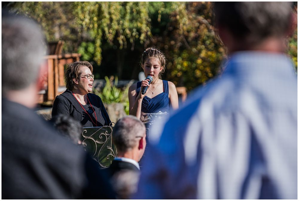 brides's daughter sings a wedding song