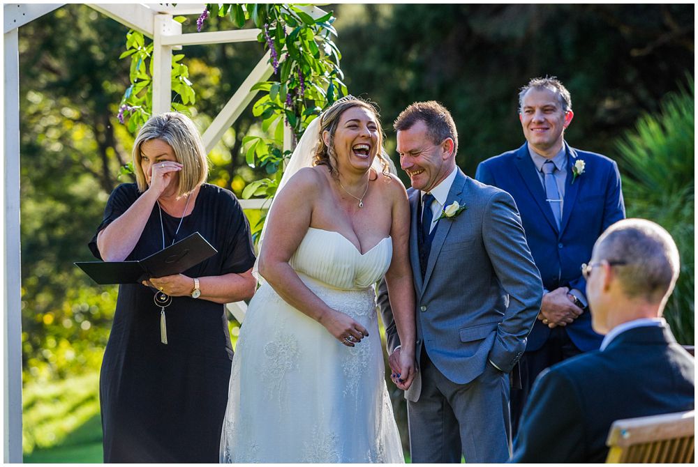 bride and groom laughing