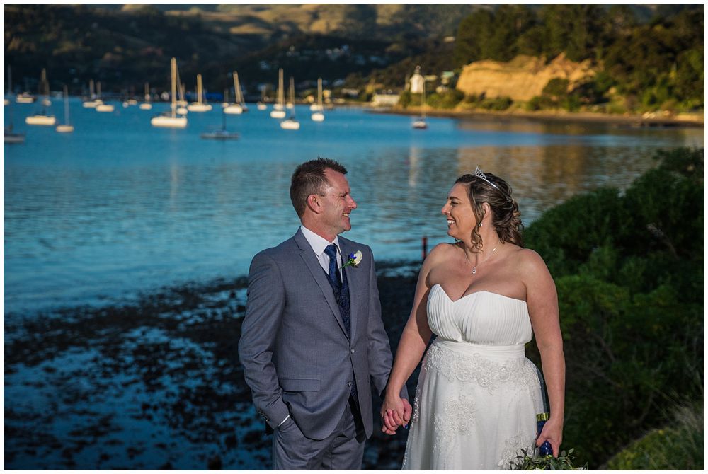 wedding couple standing in front of harbour