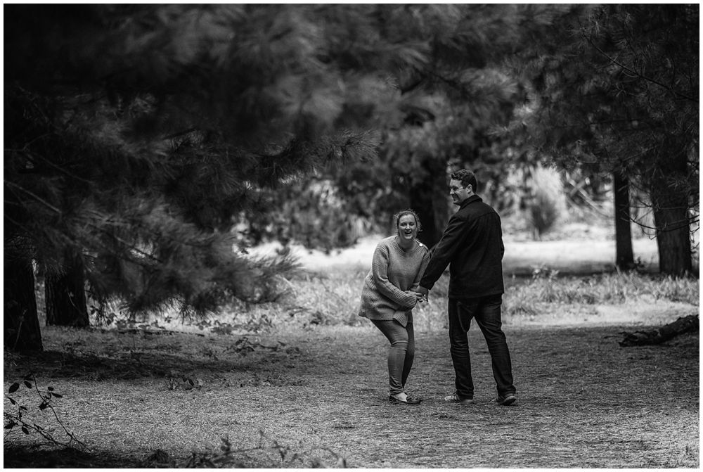 Couple having a laugh in Bottle Lake Forest