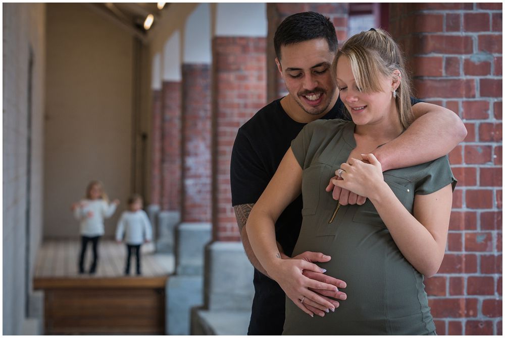 couple with children in background