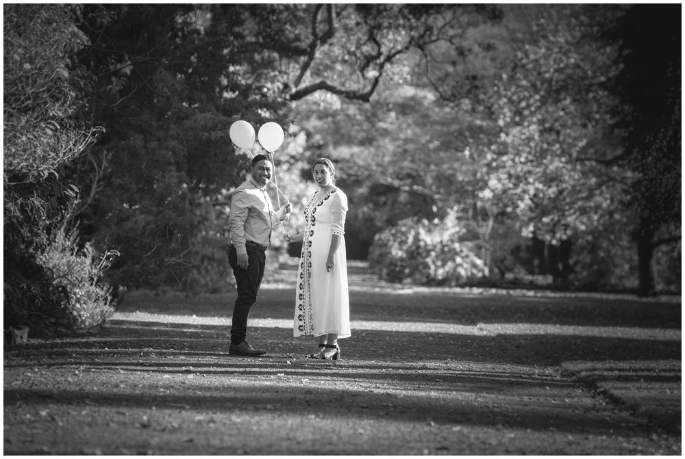 couple standing on path in park during autumn