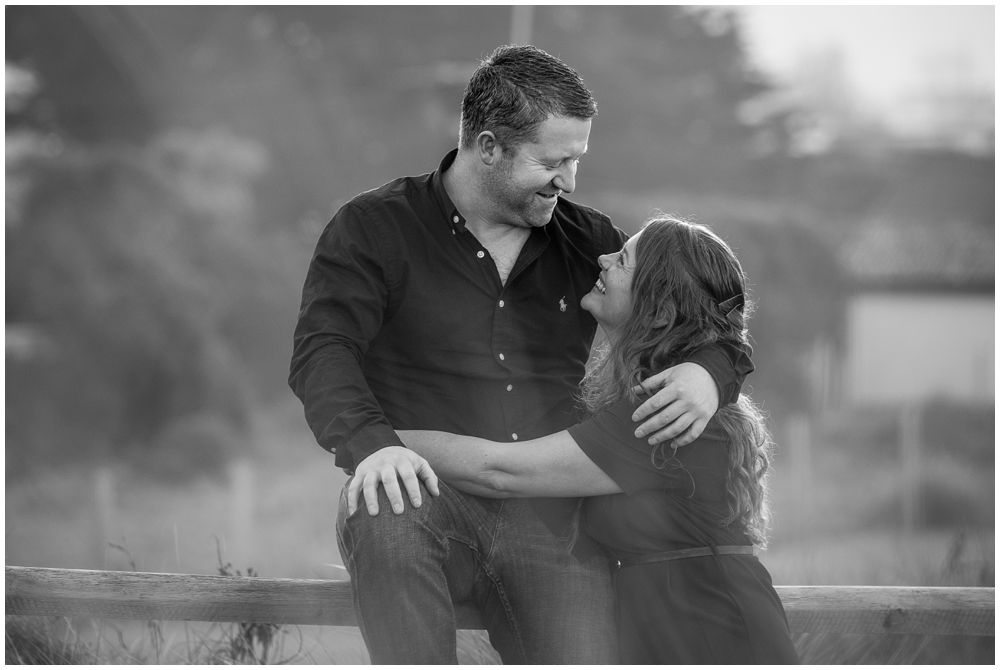 engaged couple looking at each other