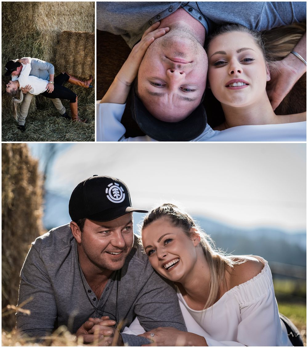 playful engaged couple in a barn