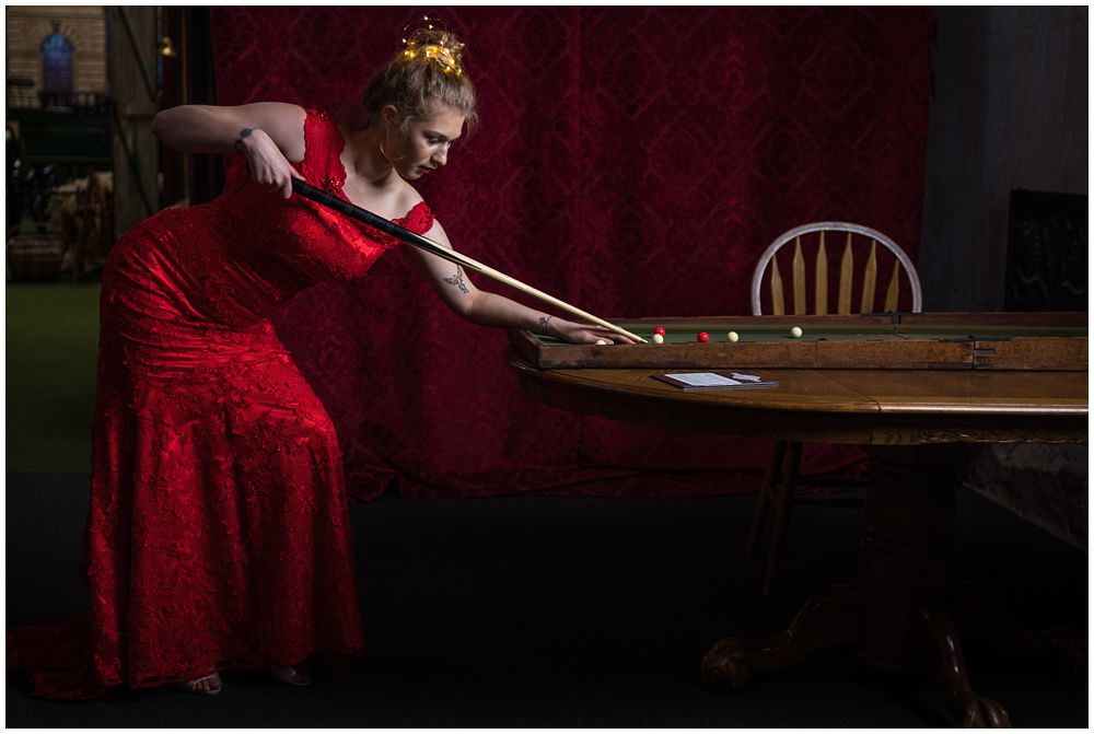 bride in red dress playing pool christchurch wedding photographer photo