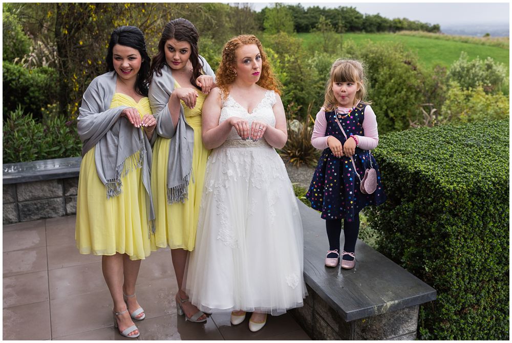 Bride and bridesmaids pose for photos waipuna estate wedding 