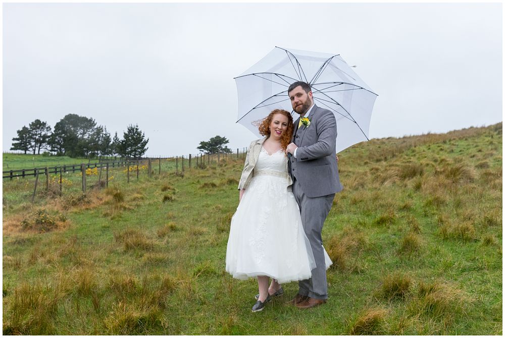 Waipuna Estate wedding photos of Bride and groom on a hill in Tai Tapu