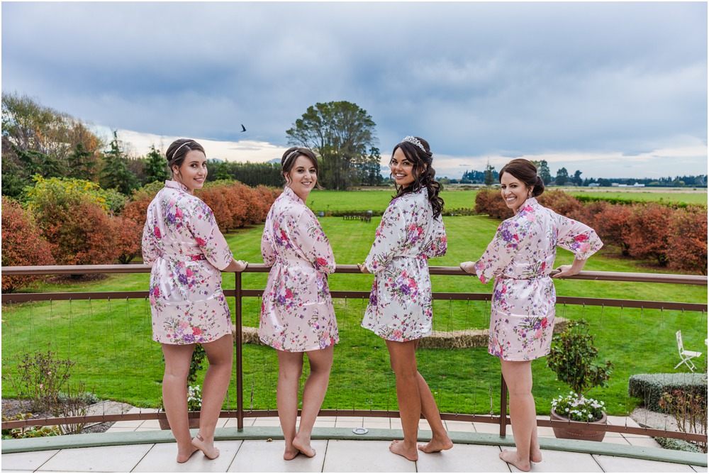 Harpers Homestead Wedding-bride with bridesmaids in dressing gowns on the balcony